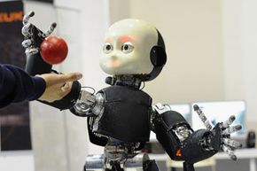 A humanoid robot plays ball at the 2012 Robotica Humanoid and Service Robots Expo in Milan, Italy in November 2012. See More Robot Pictures.