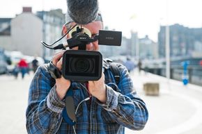 Cameraman filming subject