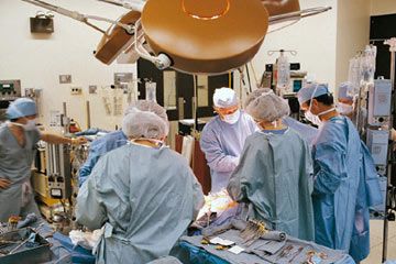 surgeons at work in operating room