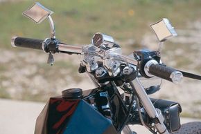 The Rebel's mirrors and handlebars display distinct features.