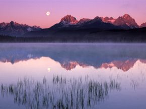Sawtooth Mountains reflecting in Little Red Fish Lake, sunrise