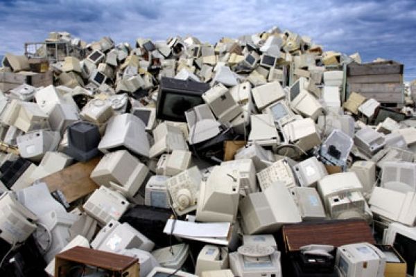 Used televisions and computer monitors pile up at a recycling center in Norway. Americans junked almost 3 million tons of electronics in 2006. A large amount of the electronics that are collected for recycling are sent overseas.