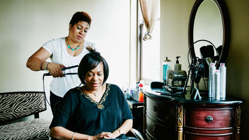 black woman getting flat iron