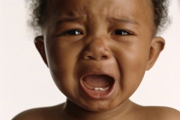 african american baby crying, showing baby teeth