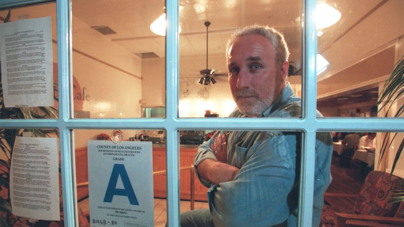 A Los Angeles restaurant owner is shown with his 'A' rating. Ron Bull/Toronto Star via Getty Images