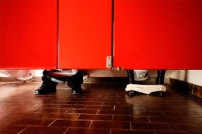 The old 'crouch and spy' under the stall is a time-honored method for determining if it's unoccupied. But some newer stalls don’t allow a peek.