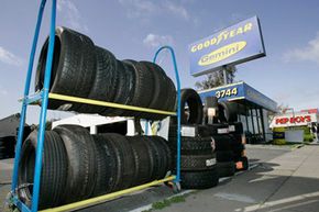Tires are displayed outside of a shop in San Jose, Calif.