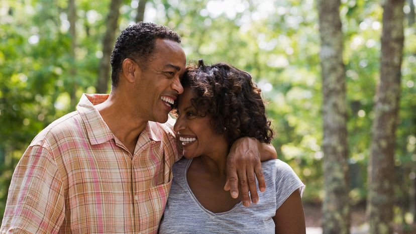 black couple walking in the woods