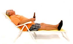 older man relaxing with a beer