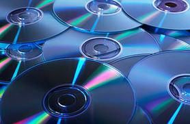 Several CDs spread out on a surface.