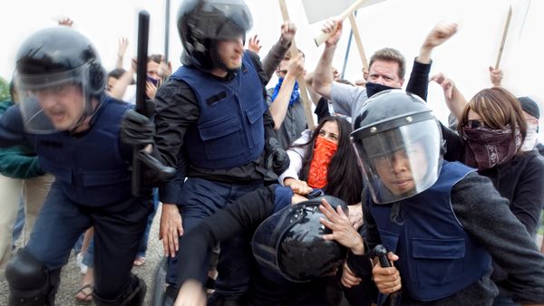 Riot Police Try to Control Angry Mob