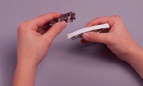 Photo of stones being glued to a barrette