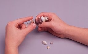 Photo of stones being placed on a barrette