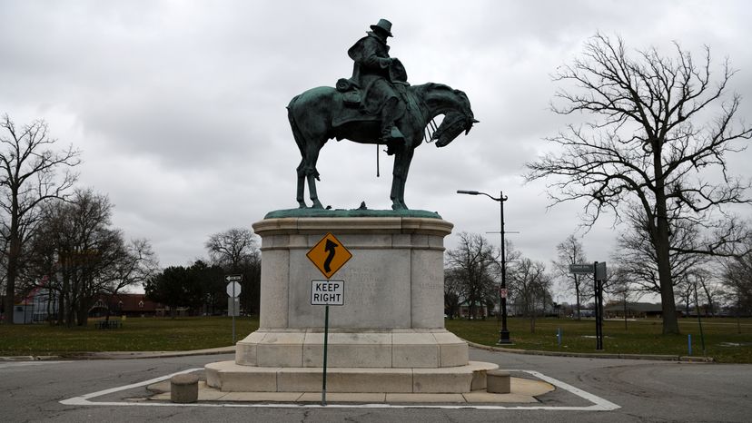 Keep right sign in front of Alpheus Starkey Williams Monument at Belle Isle Park, Detroit, Wayne County, Michigan, USA