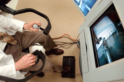 Surgeon demonstrating a robot