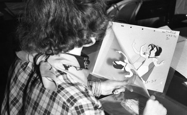 A Disney animator working with on a character motion sequence for "Snow White and the Seven Dwarfs" circa 1936. 