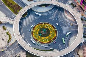 This Shanghai, China, roundabout features a pedestrian circle hovering above it.