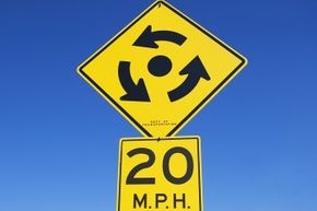 Simply proceed with caution, yield to traffic in the roundabout and follow the signs, and you should be fine.