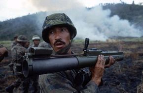 An Ecuadoran commando checks the back blast area before firing an M-72 light anti-armor weapon (LAW) during small unit training conducted as part of the joint Ecuadoran/U.S. exercise Blue Horizon '86.
