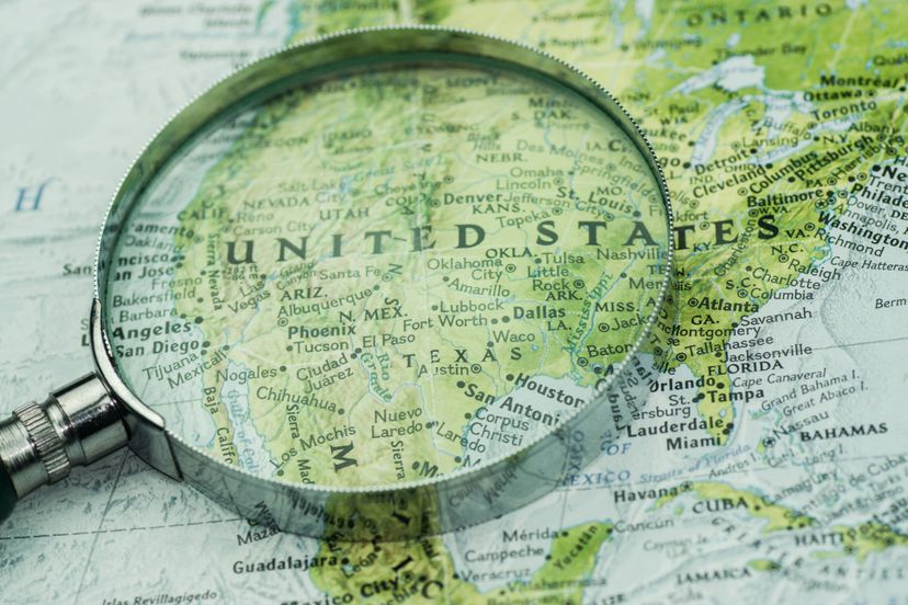 A shot of magnifier glass over the US on a map.