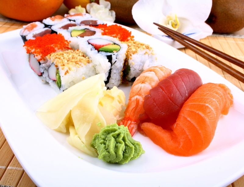 sushi with wasabi and chopsticks