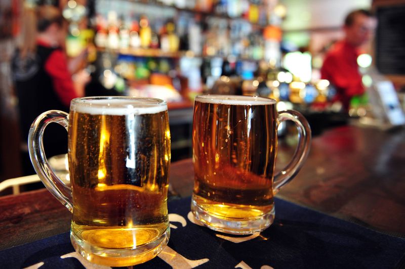 Two cups of beer in a pub in New Zealand