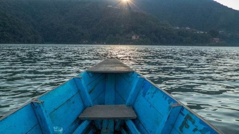 Rowing across Phewa lake to begin our hike