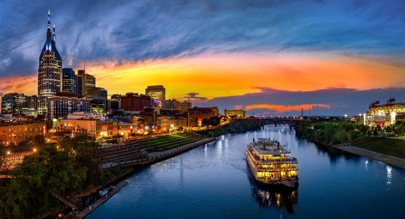 Nashville, Tennessee city at night over the river