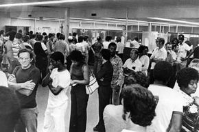 Unemployed autoworkers queuing at an unemployment office in Detroit, Michigan in 1980. The end of 1970s stagflation led to a significant U.S. recession.