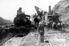 An American steam shovel delivering coal to a steam engine