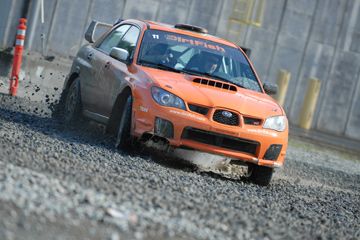 Note that the DirtFish instructor in the passenger seat is pointing out to the driver where to look and where his hands should follow to steer the car out of the skid. Whooping as you do it is optional, but encouraged.