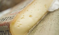 Taleggio may smell like wet grass, but it tastes salty with a hint of fruit and goes great with salads.