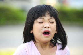 Little girl about to sneeze