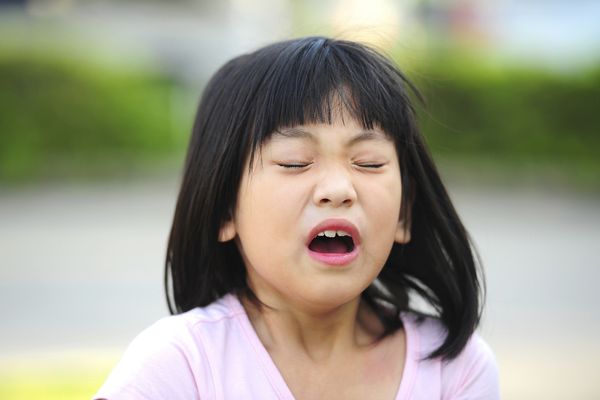 Little girl about to sneeze