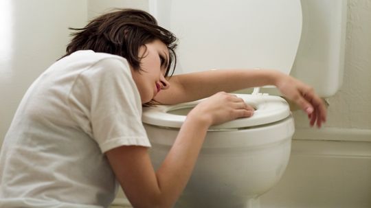 Why do stomach bugs make you throw up?