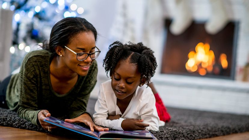 mother and daughter reading book