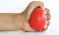 hand clutching stress ball