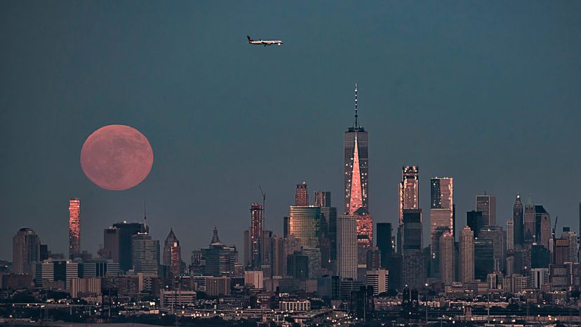 Full Strawberry moon of June rising over Manhattan