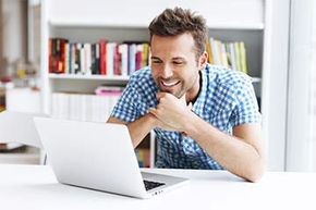 man looking at laptop