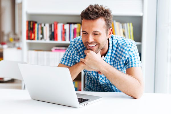 man looking at laptop