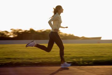 Athlete running, exercising for sport.