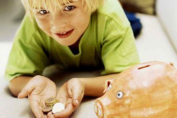 child with piggy bank