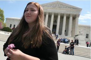 Savana Redding leaves the U.S. Supreme Court building after hearing arguments in the case she brought to the High Court in 2009. See pictures from civil rights history.
