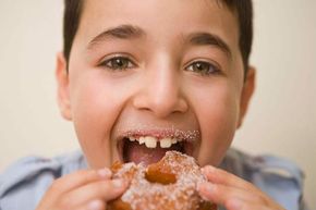 boy eating donut