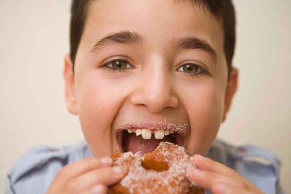 boy eating donut