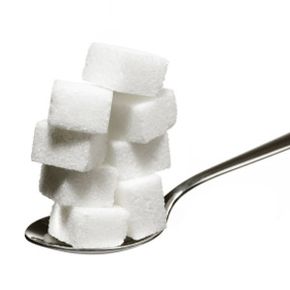 Spoon with sugar cubes.