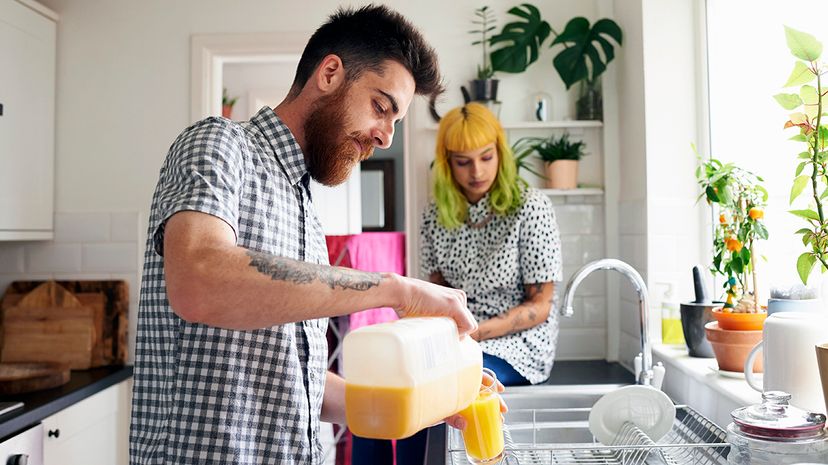 young couple drinking OJ