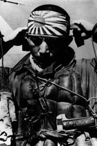 A Japanese kamikaze pilot ties on his honorary ribbon before departing on his suicide mission.