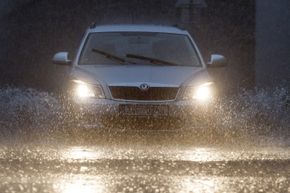 A car drives through floodwater in Prague.