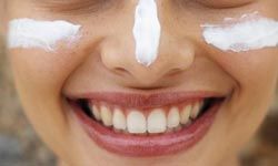 woman with white zinc oxide on her face